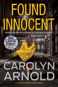 Found Innocent Large Print Edition by Carolyn Arnold, a woman in a yellow overcoat running down an alley at night