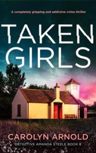 Taken Girls by Carolyn Arnold, an old schoolhouse with red doors with the sun setting in shades of teal, and pink.