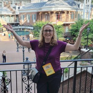 Carolyn Arnold with hands raised celebrating 10 years as a full time author at the Gaylord Opryland Resort Nashville, Tennessee, during Bouchercon.